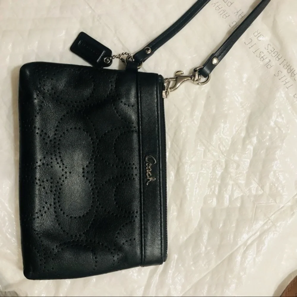 Coach signature perforated c wristlet bag